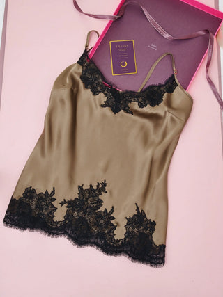 Silk garment laying on a table with it's gift box