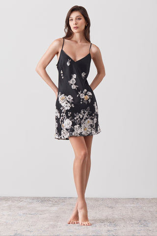 Woman wearing a short dress in silk painted by hands in a white background -n SHIKKOSA