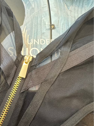 Close-up of a golden accessory ZIP detail