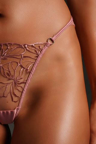 Close up front side detail of a brief panty in color Cipria